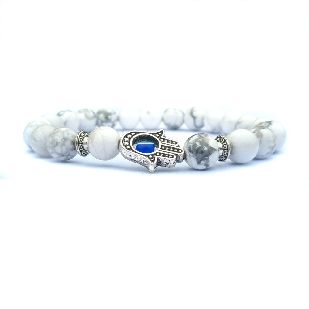 Bracelet Hamsa en pierre naturelle, symbole de protection contre le mauvais œil.