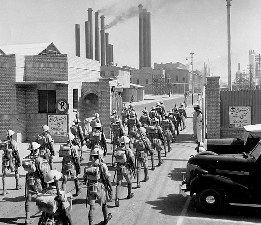British Indian Army riflemen entering the main gates of Abadan oil refinery in Iran in September 1941